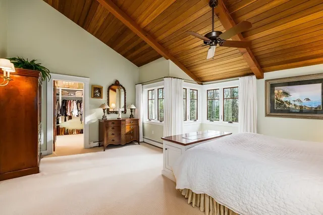 a bed room with a bed and a walk in closet