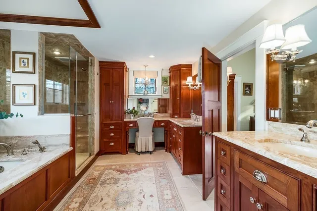 a large bathroom with a double vanity sink a tub and shower