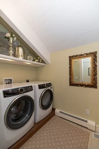 a utility room with sink dryer and washer