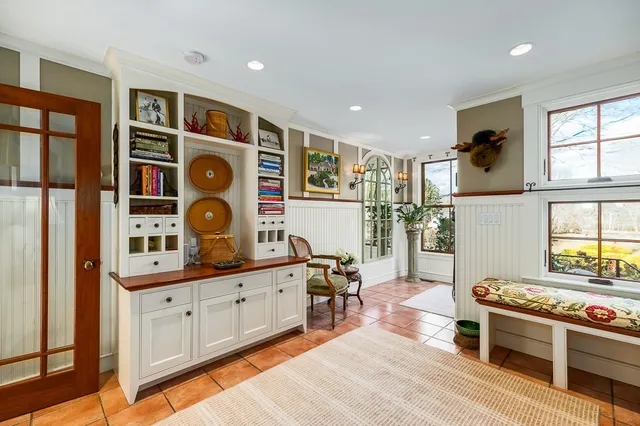 a kitchen with stainless steel appliances kitchen island granite countertop a stove a sink and a refrigerator