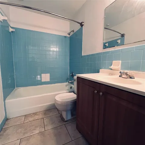 a view of walk in closet with wooden floor