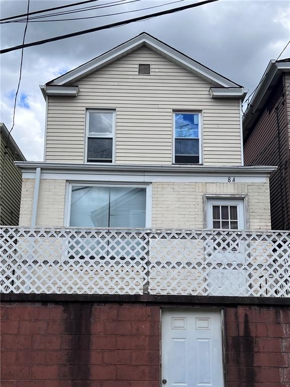 84 Frazier Avenue McKees Rocks, PA 15136 - Photo 1 of 14 a front view of a house with a wooden fence