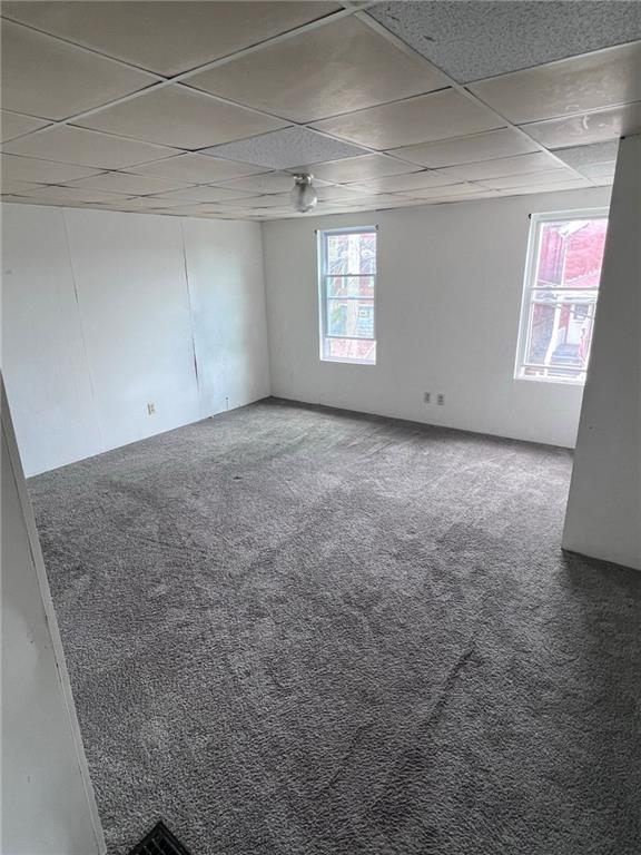 84 Frazier Avenue McKees Rocks, PA 15136 - Photo 5 of 14 a view of a big room with windows and chandelier fan