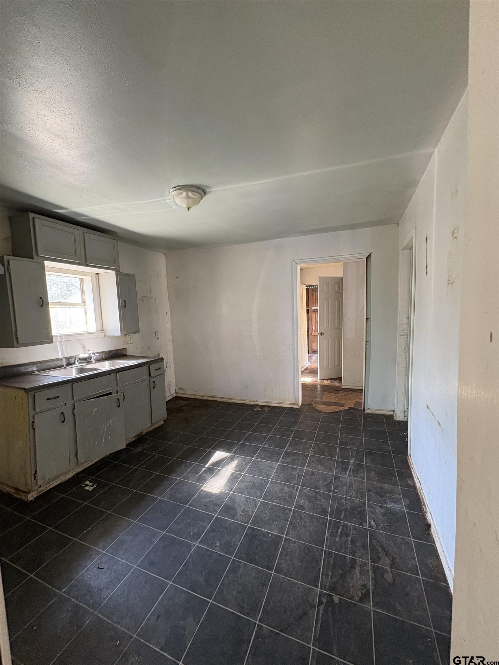 166 Alvin Rusk, TX 75785 - Photo 4 of 8 a view of a kitchen with a sink and a window