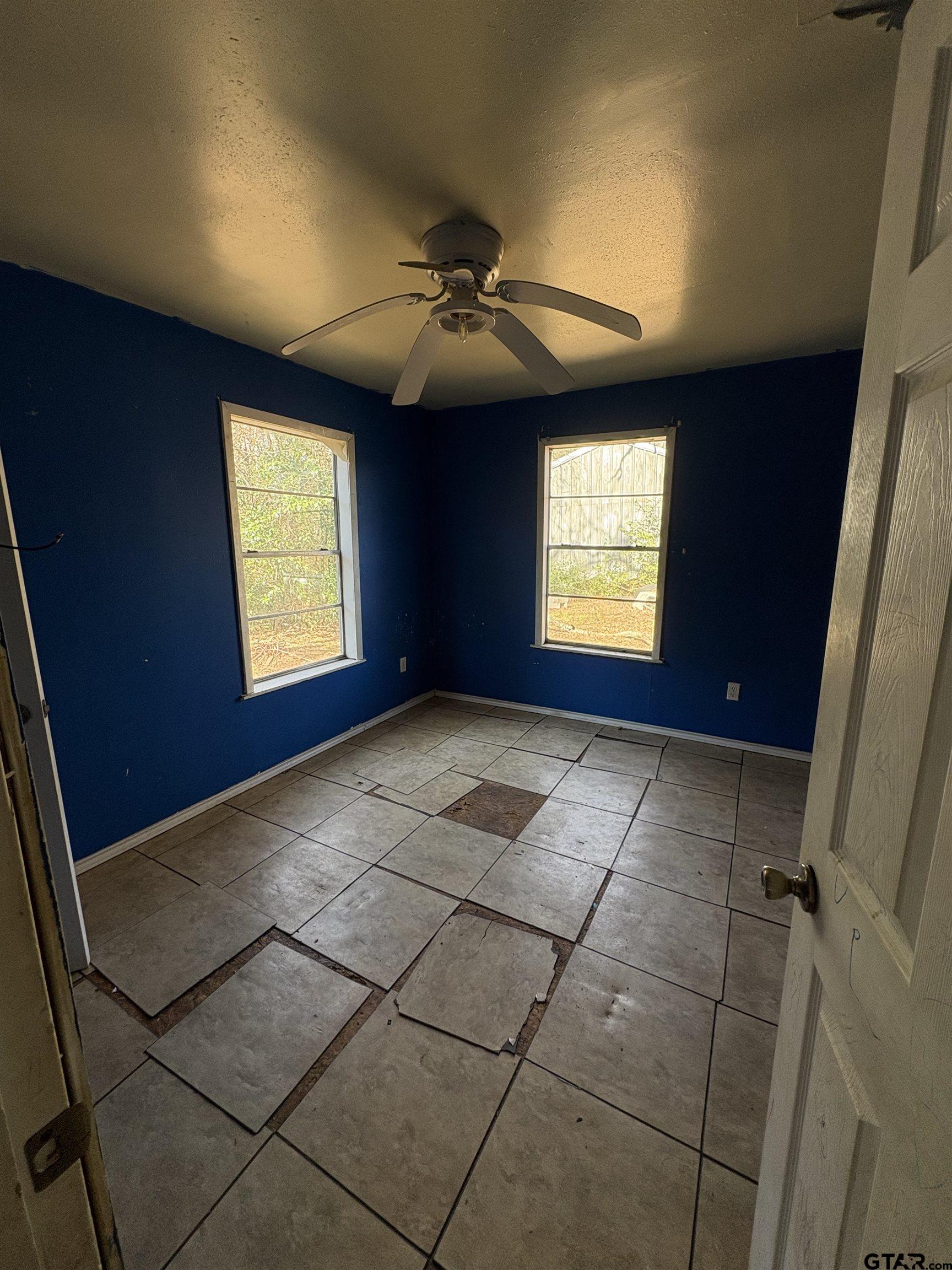 166 Alvin Rusk, TX 75785 - Photo 5 of 8 a view of an empty room with window and chandelier fan