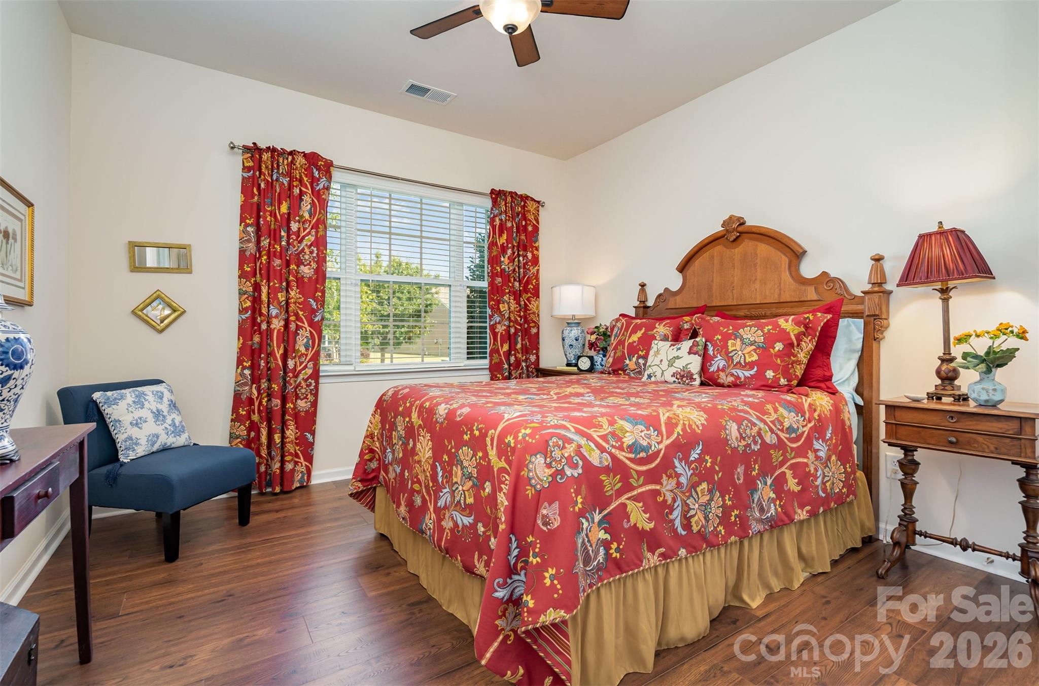 1627 Tranquility Boulevard Lancaster, SC 29720 - Photo 12 of 40 a bedroom with a bed and a chandelier