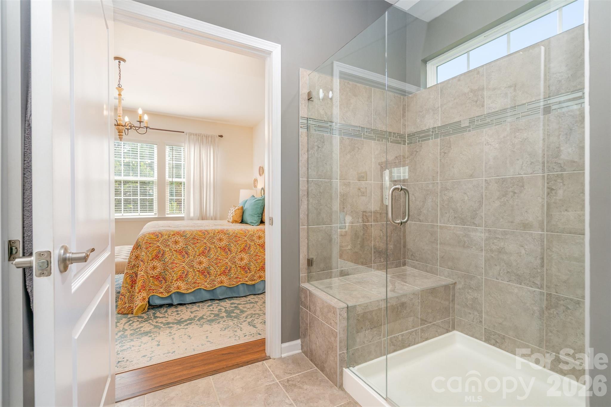 1627 Tranquility Boulevard Lancaster, SC 29720 - Photo 18 of 40 a bathroom with a tub shower and window