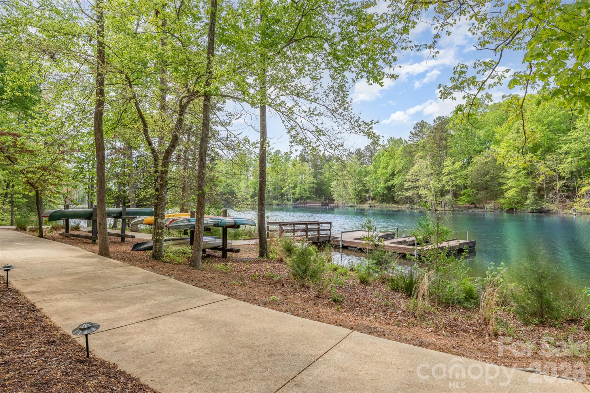 1627 Tranquility Boulevard Lancaster, SC 29720 - Photo 25 of 40 a backyard of a house with table and chairs