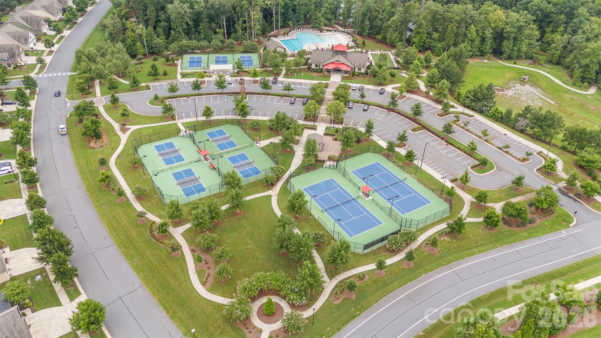 1627 Tranquility Boulevard Lancaster, SC 29720 - Photo 27 of 40 an aerial view of a swimming pool with seating area