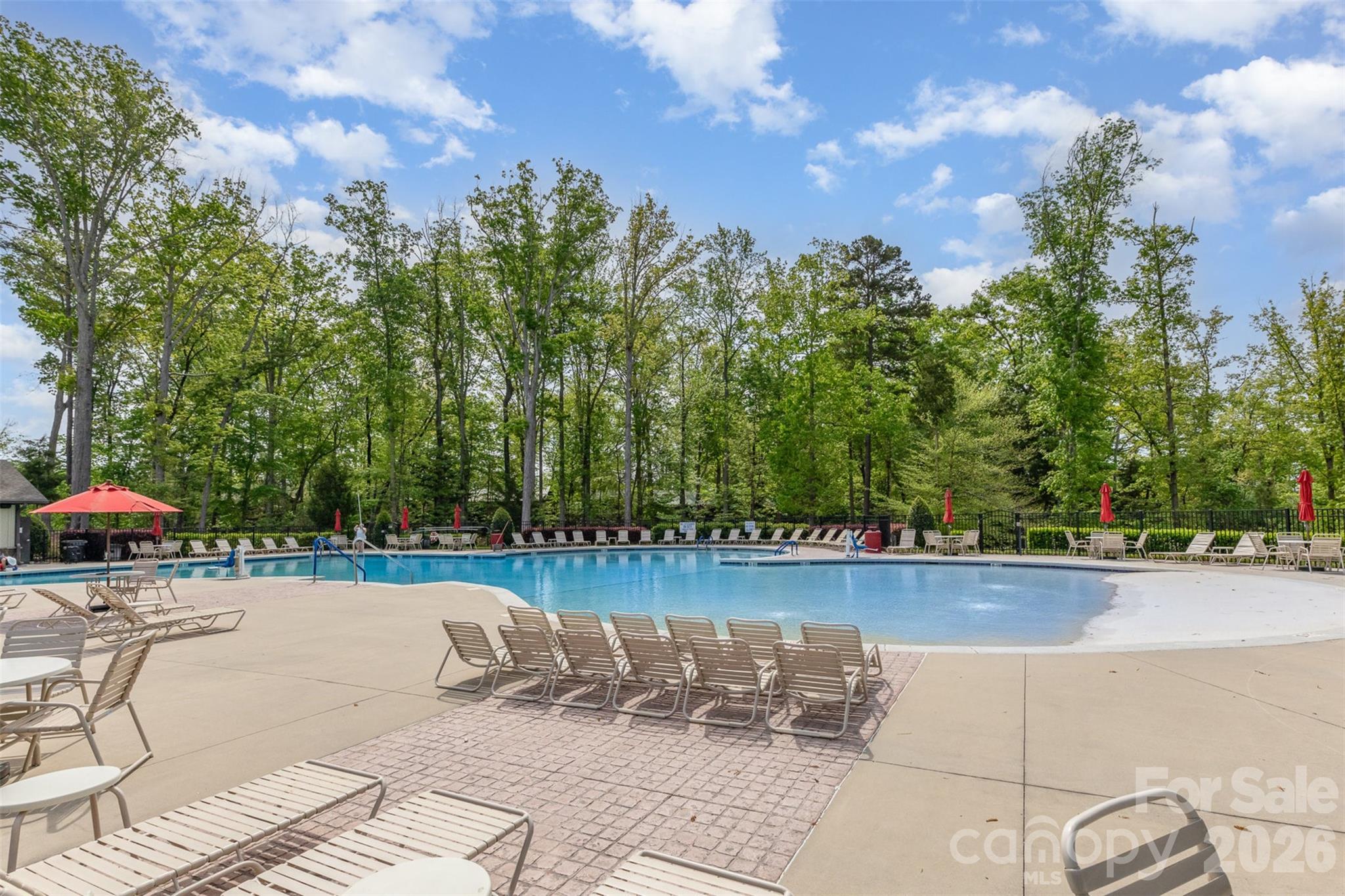 1627 Tranquility Boulevard Lancaster, SC 29720 - Photo 29 of 40 a view of a swimming pool with a lounge chair