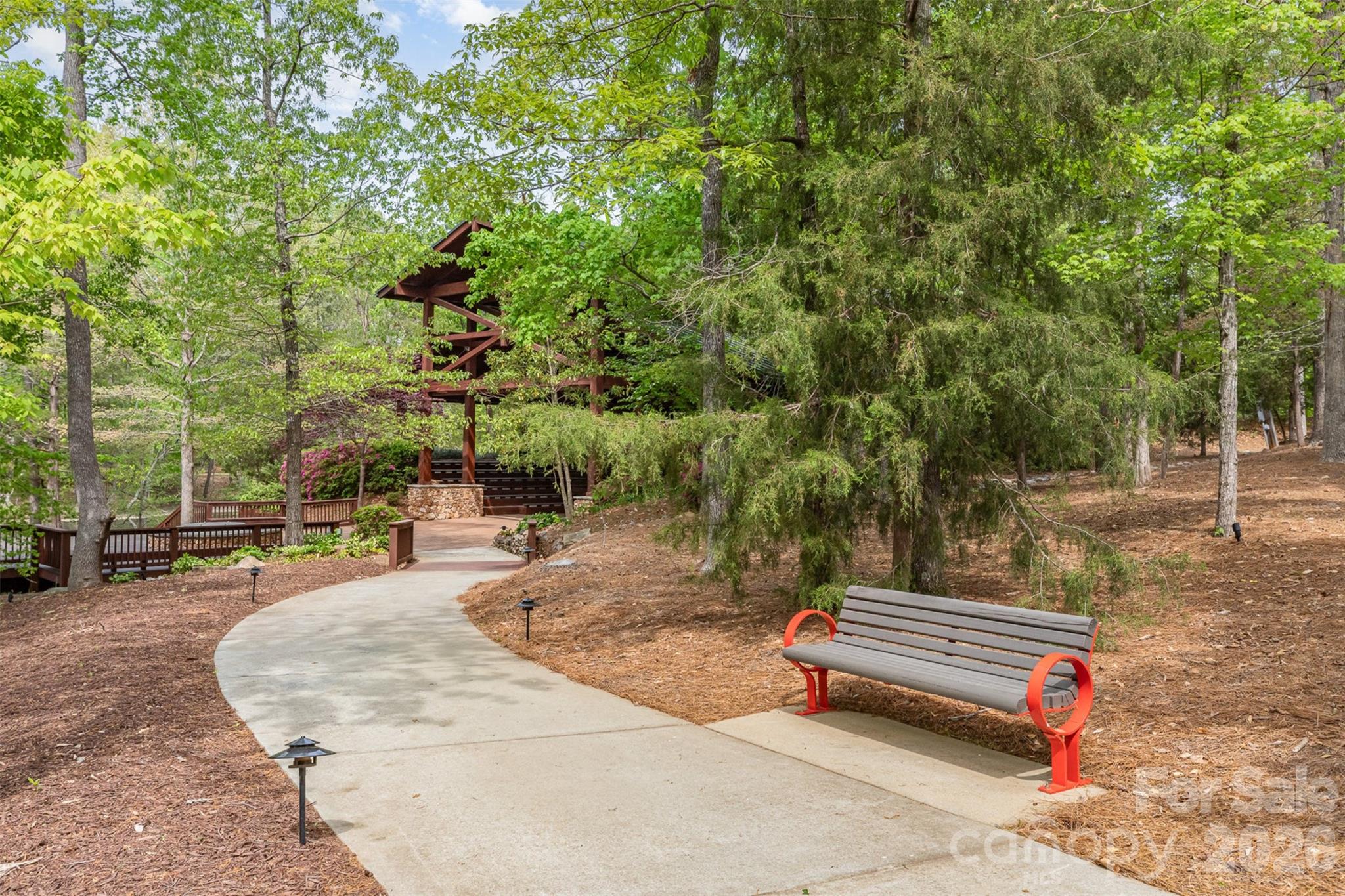 1627 Tranquility Boulevard Lancaster, SC 29720 - Photo 35 of 40 a backyard of a house with large trees and outdoor seating