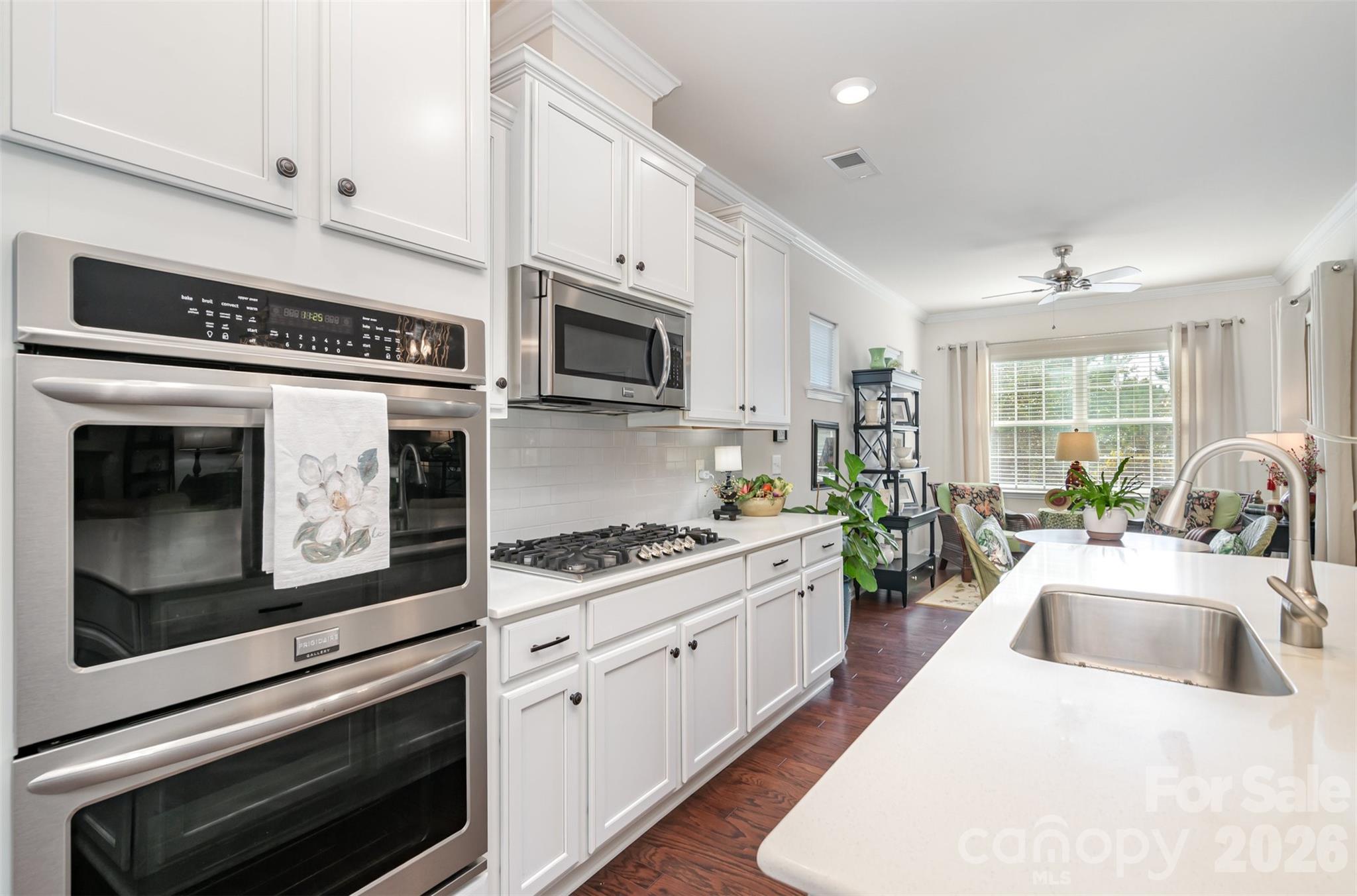 1627 Tranquility Boulevard Lancaster, SC 29720 - Photo 4 of 40 a kitchen with stainless steel appliances kitchen island granite countertop a stove sink microwave and cabinets