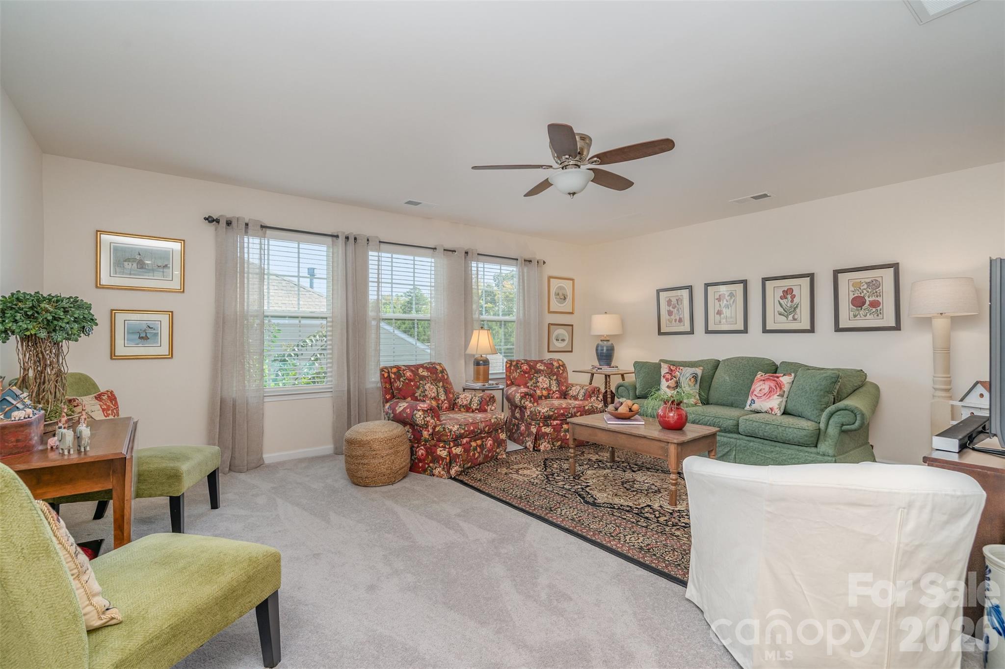 1627 Tranquility Boulevard Lancaster, SC 29720 - Photo 10 of 40 a living room with furniture and a large window