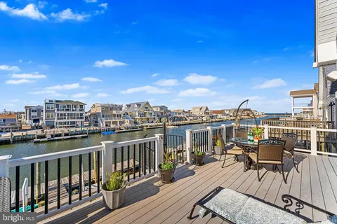 a view of a balcony with wooden benches