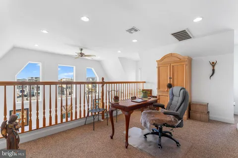 a workspace with chandelier fan