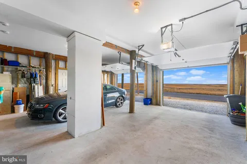 a view of a livingroom with furniture and a garage