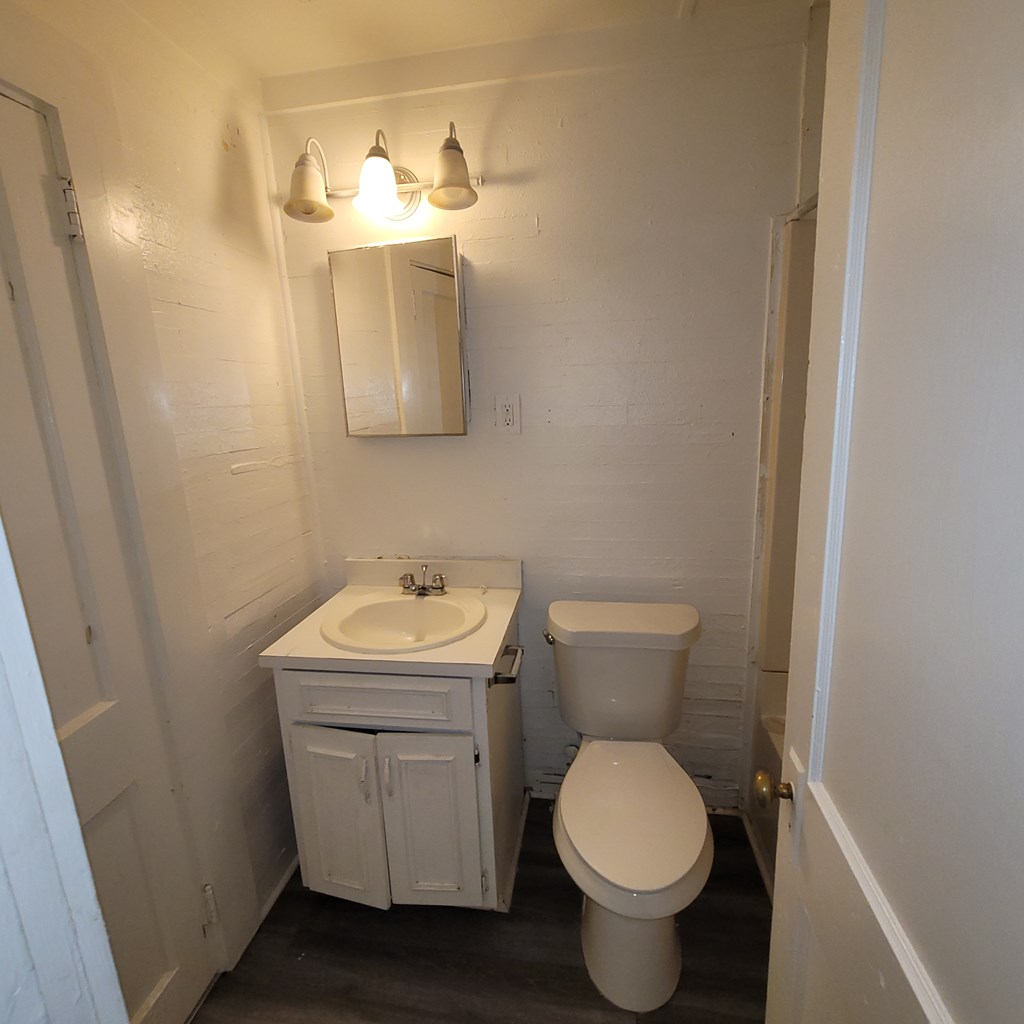 635 42nd Street Columbus, GA 31904 - Photo 14 of 14 a bathroom with a toilet sink and mirror