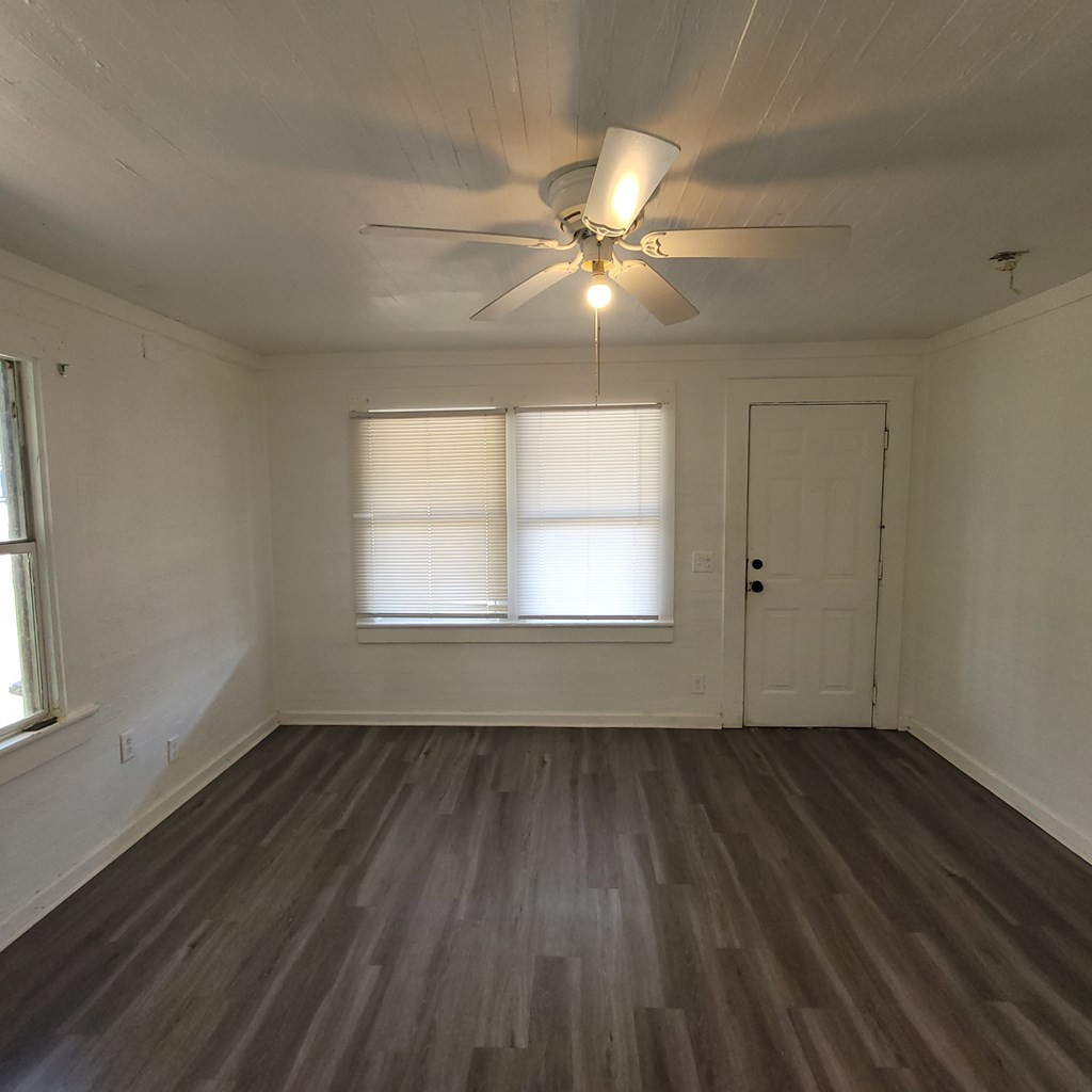 635 42nd Street Columbus, GA 31904 - Photo 4 of 14 wooden floor in an empty room with a window