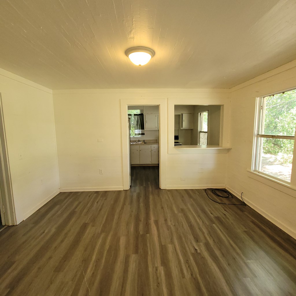 635 42nd Street Columbus, GA 31904 - Photo 5 of 14 a view of empty room with wooden floor and fan