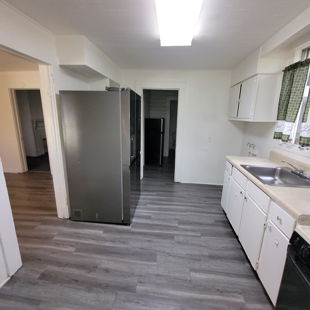 635 42nd Street Columbus, GA 31904 - Photo 8 of 14 a kitchen with stainless steel appliances granite countertop a refrigerator and a sink