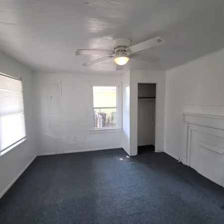 an empty room with a empty space and windows