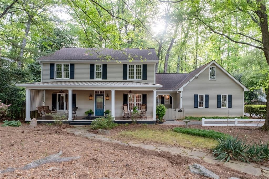 7245 Dunhill Terrace Northeast Atlanta, GA 30328 - Photo 1 of 45 a front view of a house with garden