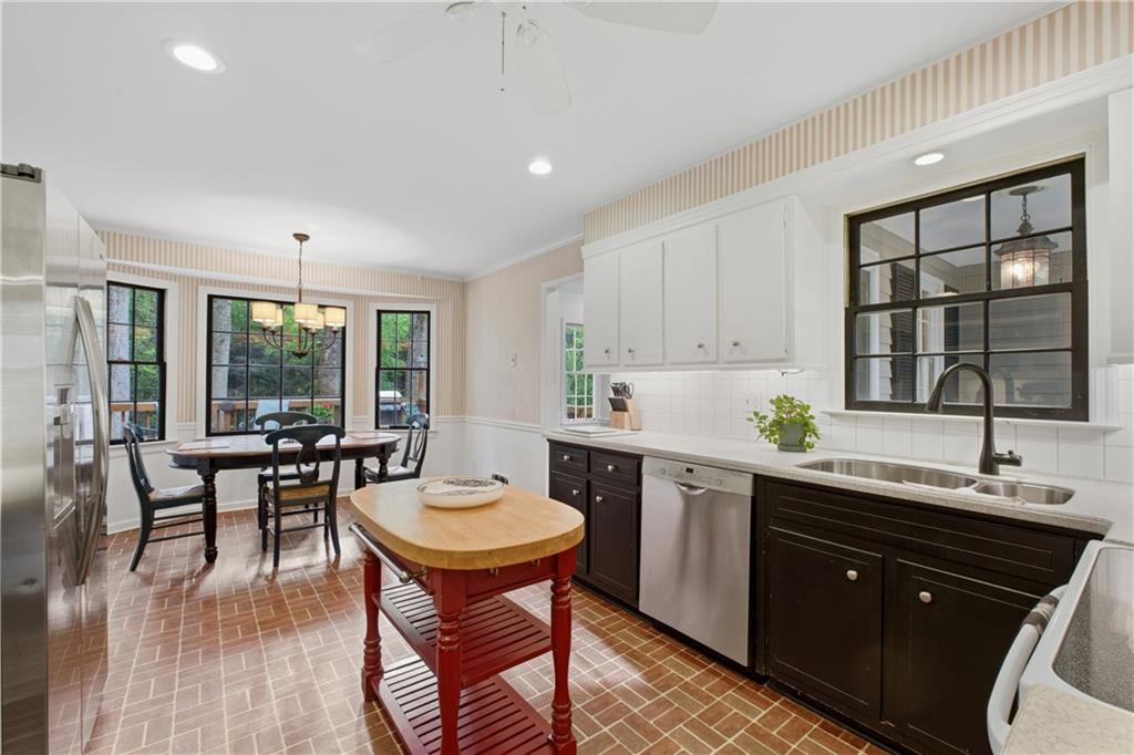 7245 Dunhill Terrace Northeast Atlanta, GA 30328 - Photo 16 of 45 a kitchen with a sink and wooden cabinets