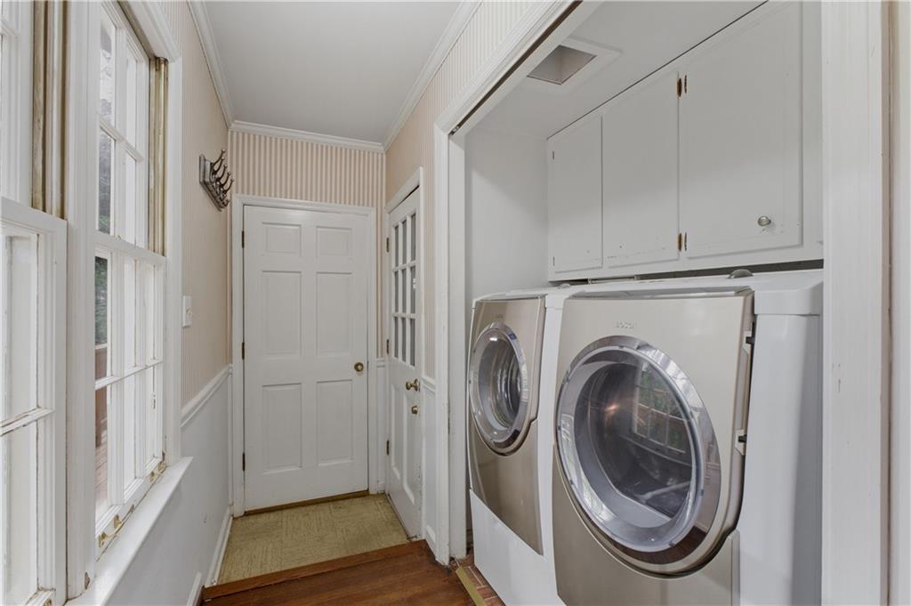 7245 Dunhill Terrace Northeast Atlanta, GA 30328 - Photo 17 of 45 a view of a storage and utility room with washer and dryer