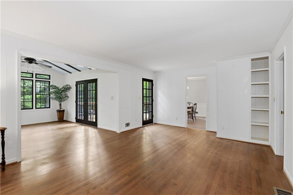 7245 Dunhill Terrace Northeast Atlanta, GA 30328 - Photo 22 of 45 a view of an empty room with wooden floor and a window
