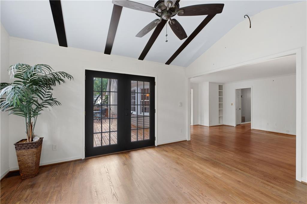 7245 Dunhill Terrace Northeast Atlanta, GA 30328 - Photo 25 of 45 a view of an empty room with window and wooden floor
