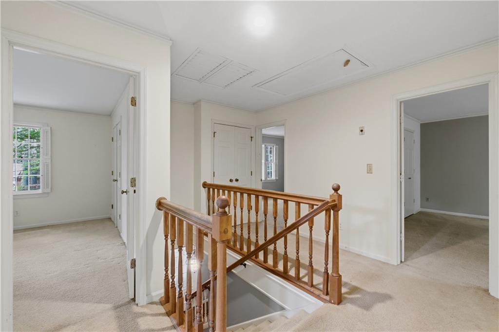 7245 Dunhill Terrace Northeast Atlanta, GA 30328 - Photo 26 of 45 a view of a hallway with staircase
