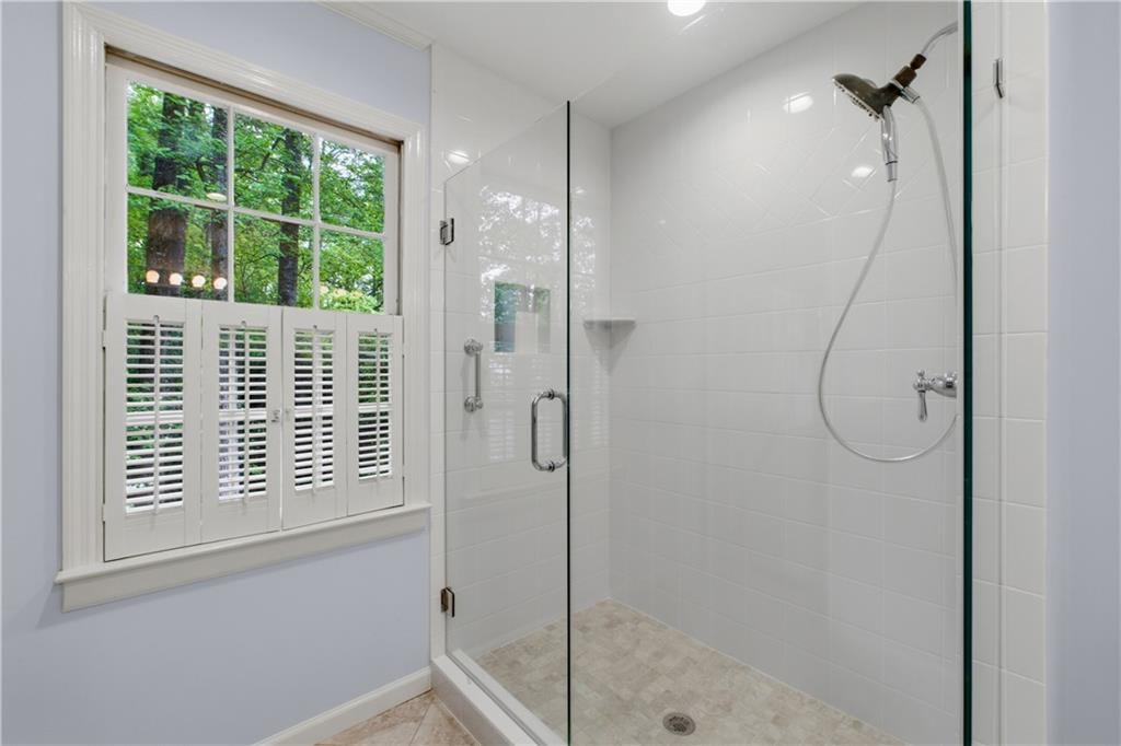 7245 Dunhill Terrace Northeast Atlanta, GA 30328 - Photo 30 of 45 a bathroom with a shower
