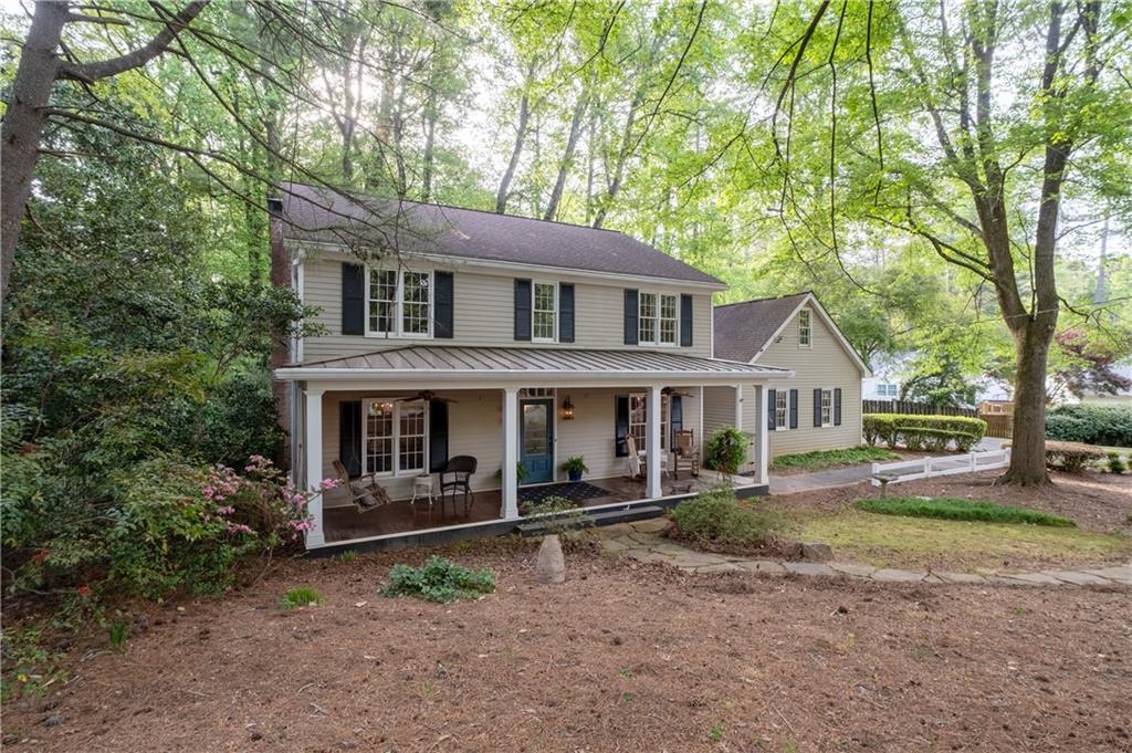 7245 Dunhill Terrace Northeast Atlanta, GA 30328 - Photo 3 of 45 a front view of a house with garden