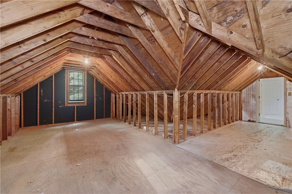7245 Dunhill Terrace Northeast Atlanta, GA 30328 - Photo 38 of 45 an empty room with wooden floor and windows