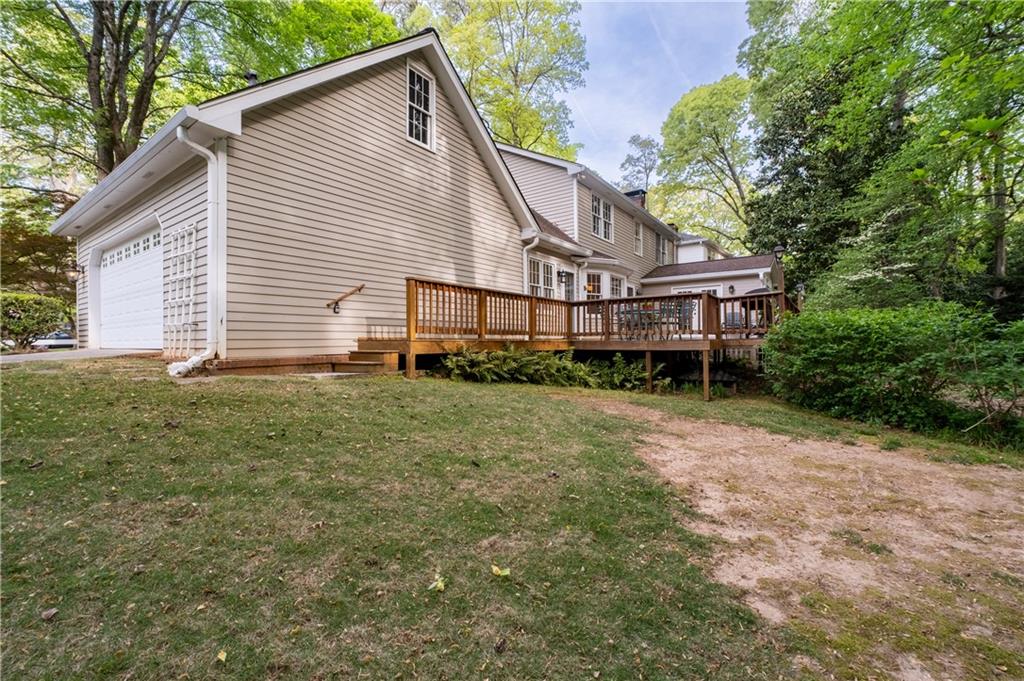 7245 Dunhill Terrace Northeast Atlanta, GA 30328 - Photo 43 of 45 a view of a house with a yard and sitting area