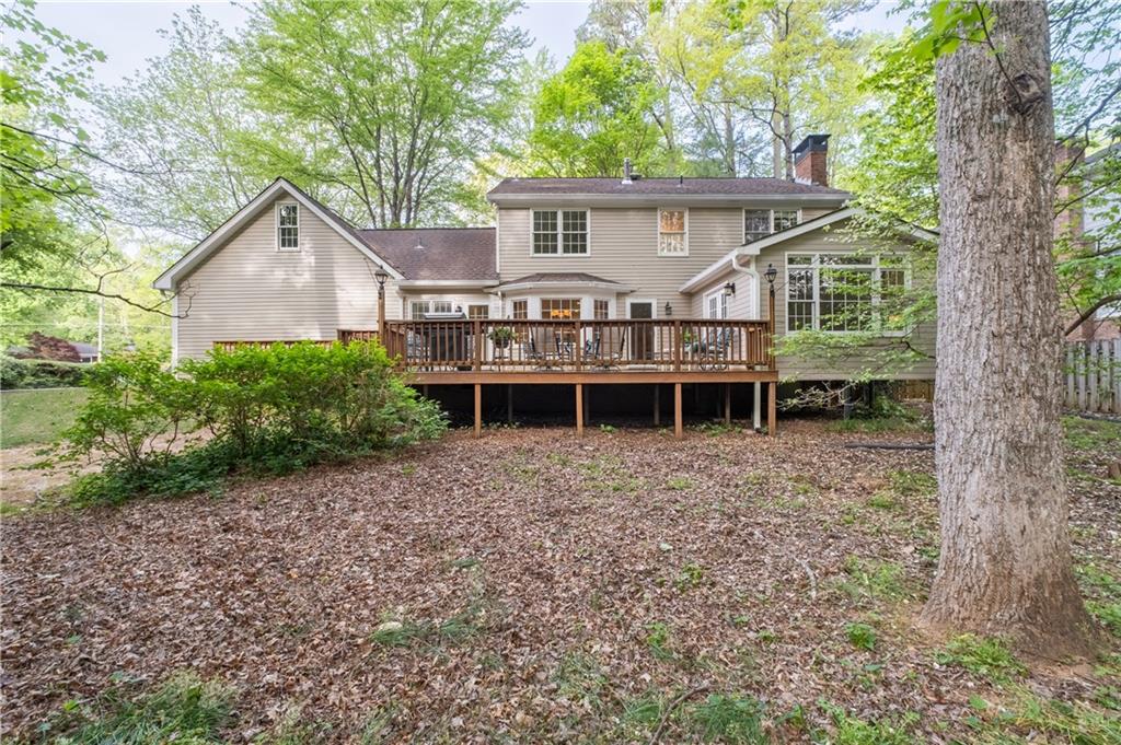 7245 Dunhill Terrace Northeast Atlanta, GA 30328 - Photo 44 of 45 front view of a house with a yard and large trees