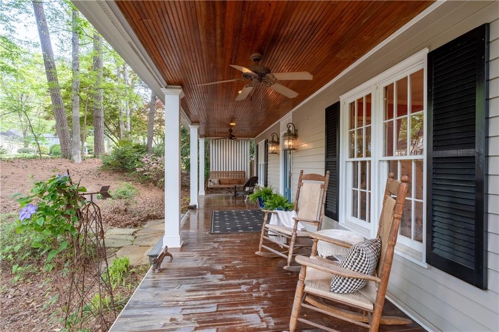 7245 Dunhill Terrace Northeast Atlanta, GA 30328 - Photo 5 of 45 a porch with chairs and potted plants