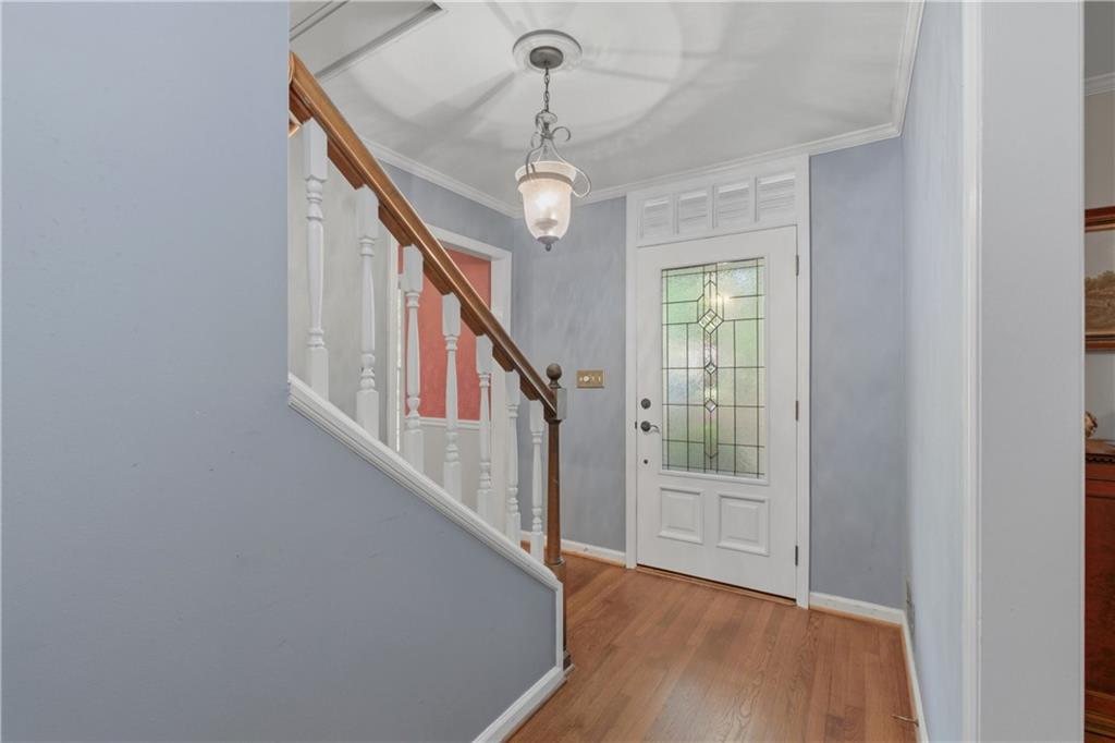 7245 Dunhill Terrace Northeast Atlanta, GA 30328 - Photo 7 of 45 a view of entryway with wooden floor