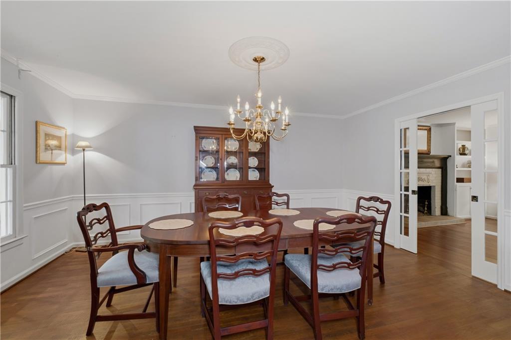7245 Dunhill Terrace Northeast Atlanta, GA 30328 - Photo 9 of 45 a view of a dining room with furniture and wooden floor