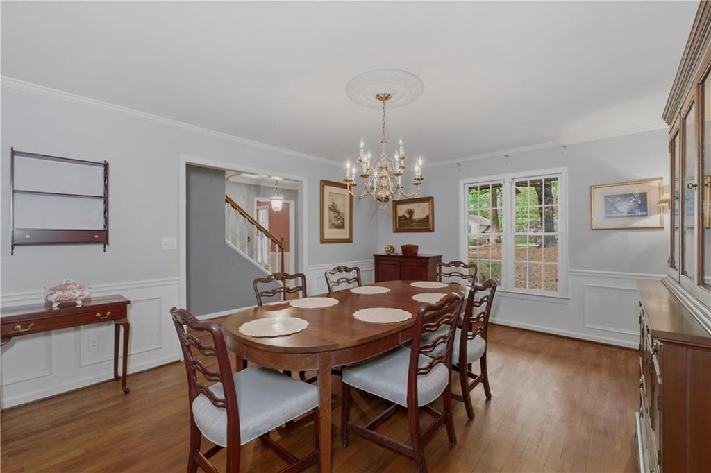 7245 Dunhill Terrace Northeast Atlanta, GA 30328 - Photo 10 of 45 a view of a dining room with furniture window and wooden floor