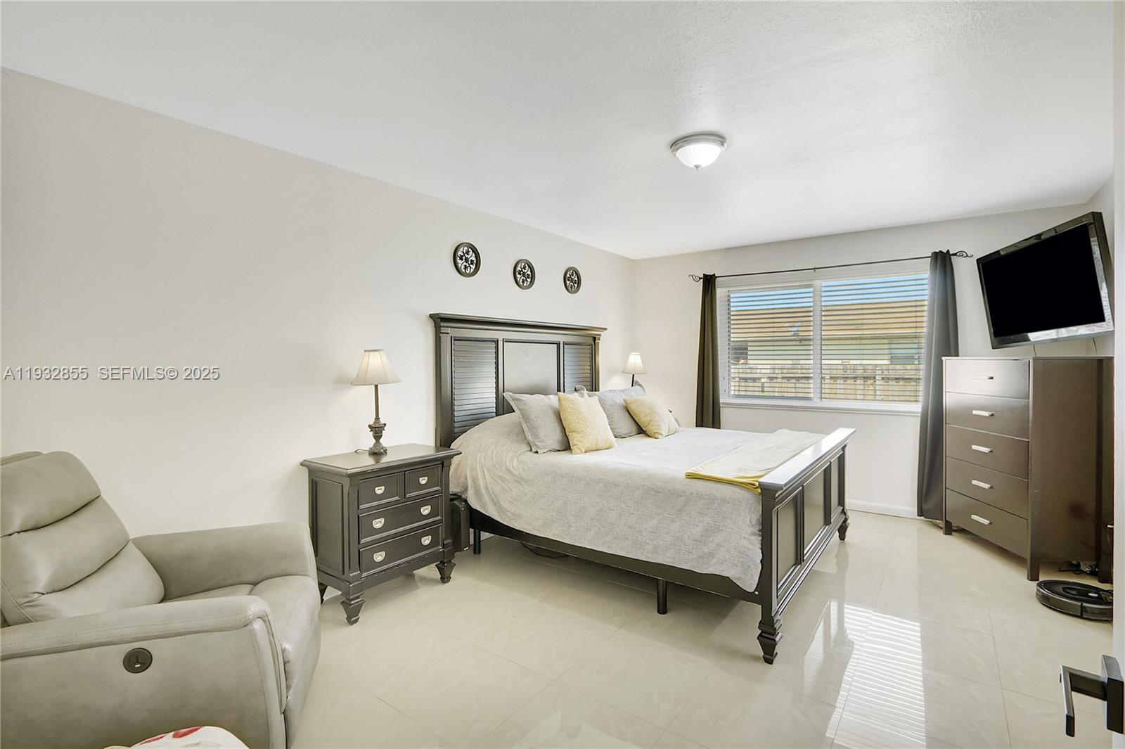 13217 Southwest 257th Terrace Homestead, FL 33032 - Photo 13 of 20 a bedroom with a bed and furniture