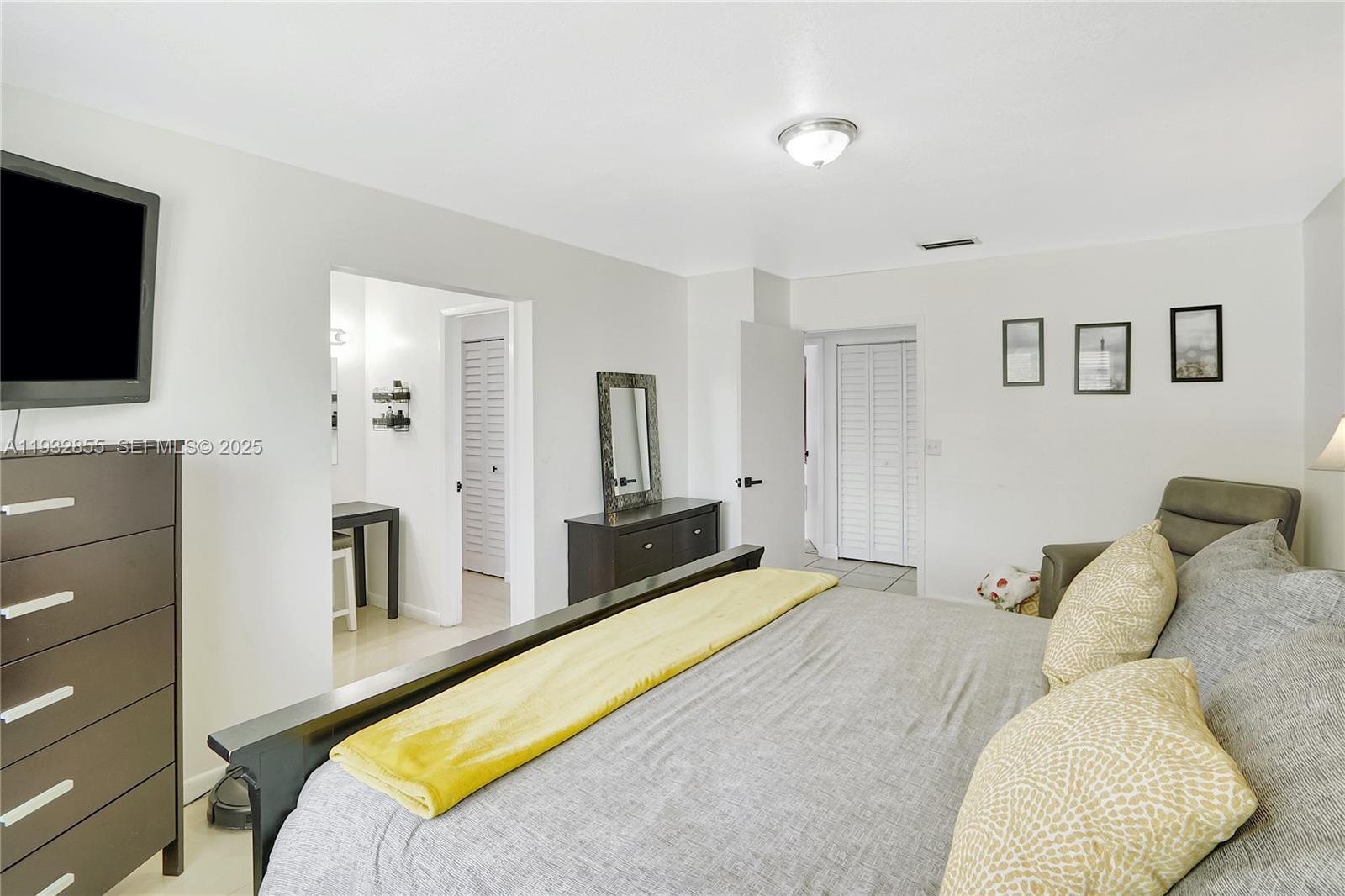 13217 Southwest 257th Terrace Homestead, FL 33032 - Photo 14 of 20 a bed room with a bed and a television