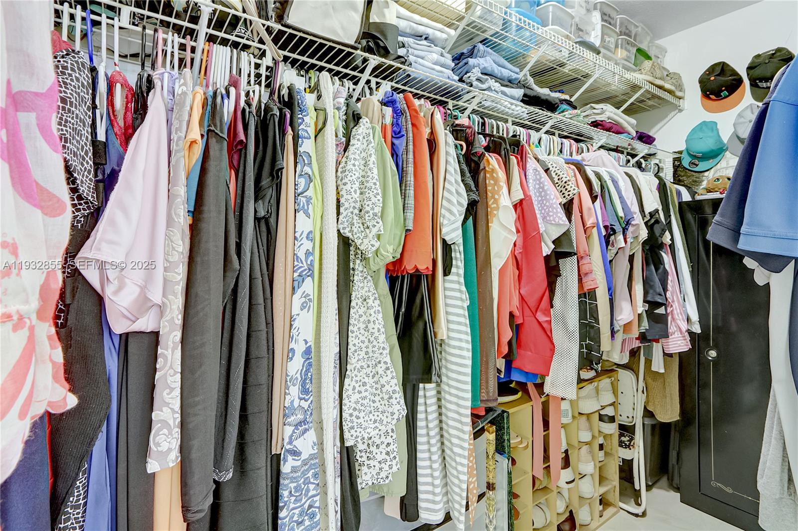 13217 Southwest 257th Terrace Homestead, FL 33032 - Photo 16 of 20 a view of walk in closet with clothes