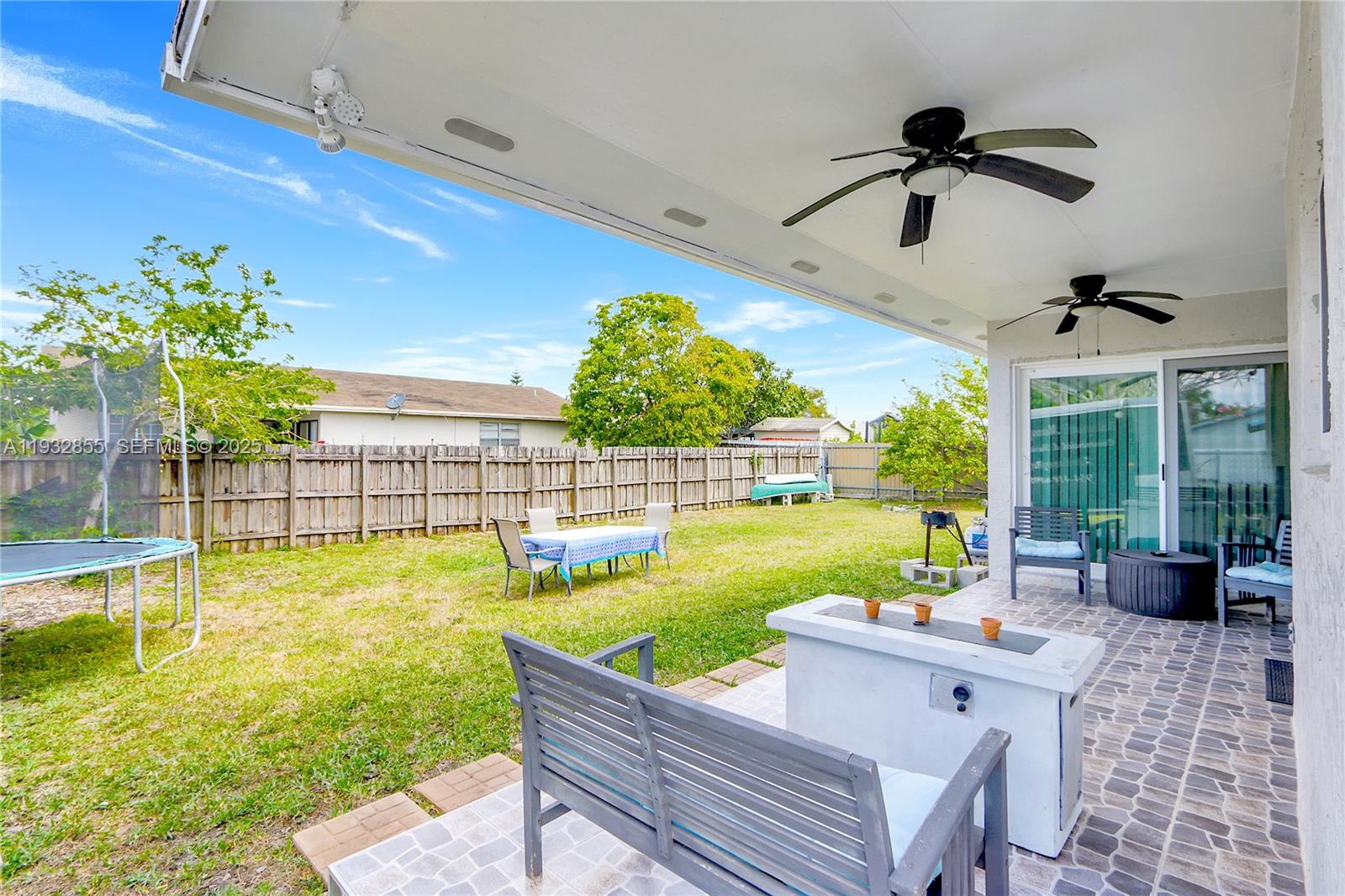 13217 Southwest 257th Terrace Homestead, FL 33032 - Photo 18 of 20 a view of a swimming pool and couches in the patio
