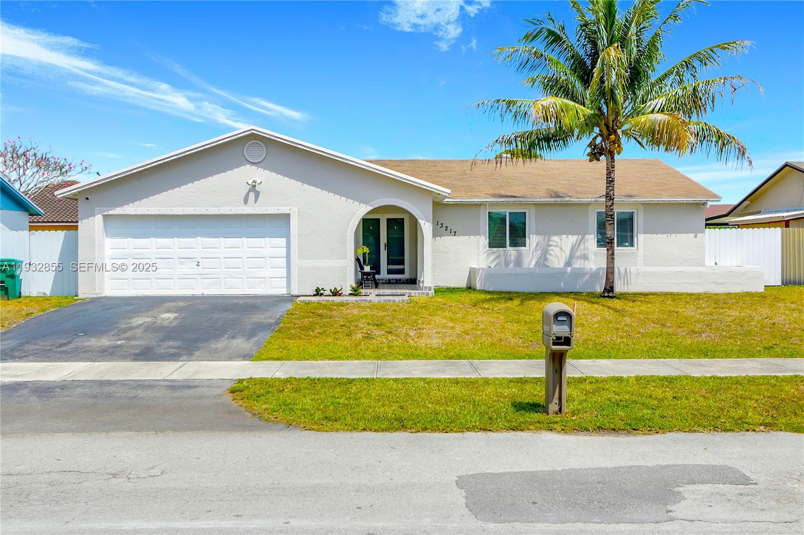13217 Southwest 257th Terrace Homestead, FL 33032 - Photo 20 of 20 a front view of a house with a yard