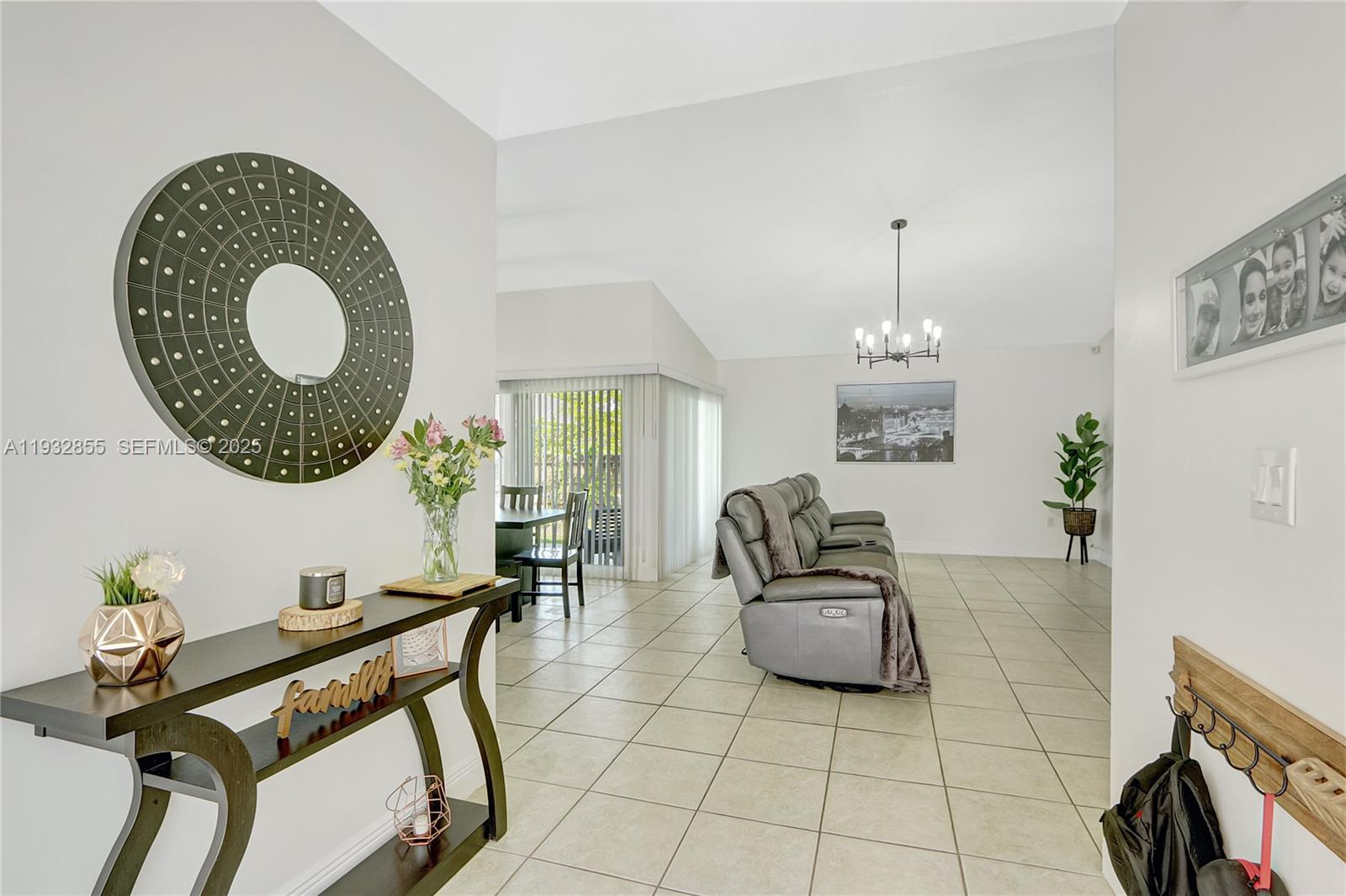 13217 Southwest 257th Terrace Homestead, FL 33032 - Photo 3 of 20 a living room with furniture and a mirror