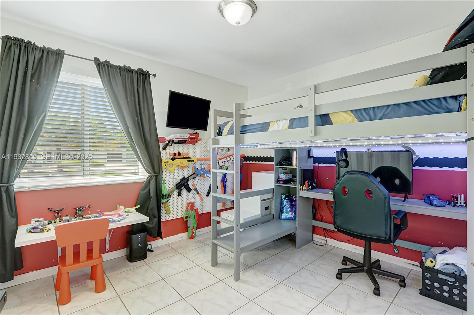 13217 Southwest 257th Terrace Homestead, FL 33032 - Photo 9 of 20 a living room with furniture and a flat screen tv