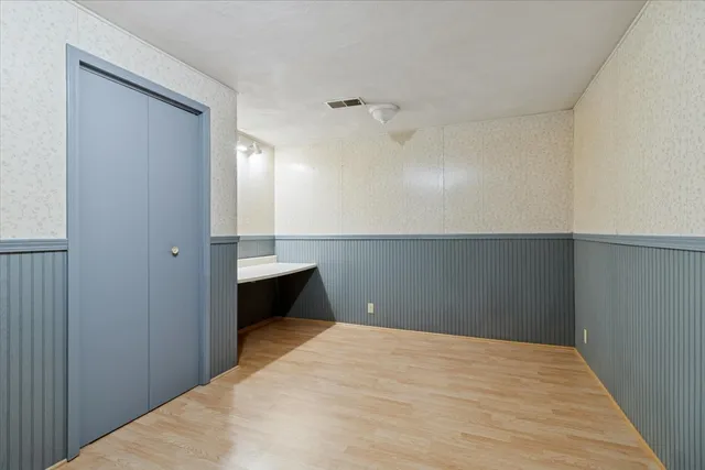 a bedroom with a bed and a table