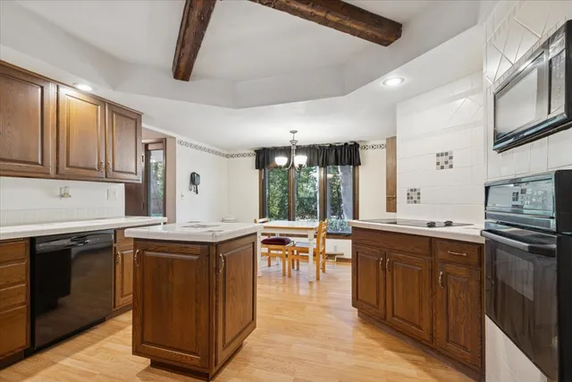 a kitchen with stainless steel appliances granite countertop a stove and a sink