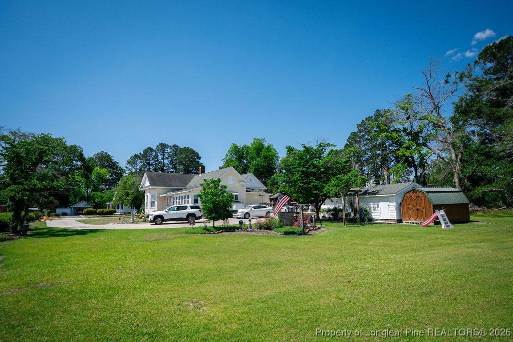 208 Thompson Street Fairmont, NC 28340 - Photo 15 of 19 a view of a house with a big yard